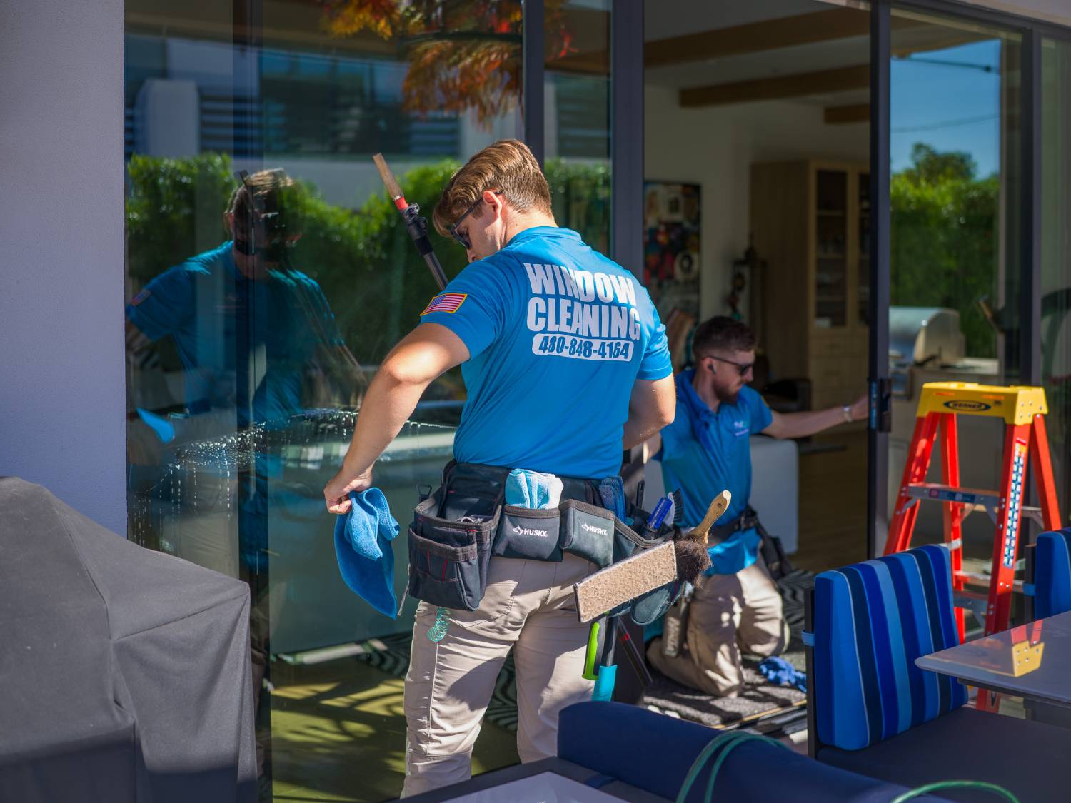 two-workers-cleaning-windows-img